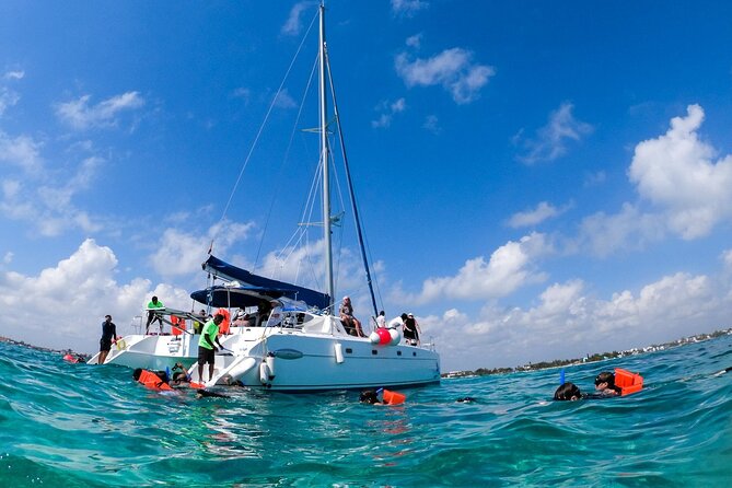 Isla Mujeres Tour on Catamaran with Snorkel, Open Bar, Buffet & Beach club - Snorkeling at El Meco Reef