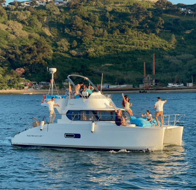 Lisbon: 3H Private Luxury Catamaran Tour with Swimming - Bar service, music, and food choices onboard