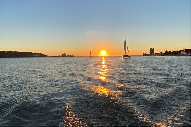 Lisbon: Catamaran Luxury Sunset and Wine Tour - Under the 25 de Abril Bridge