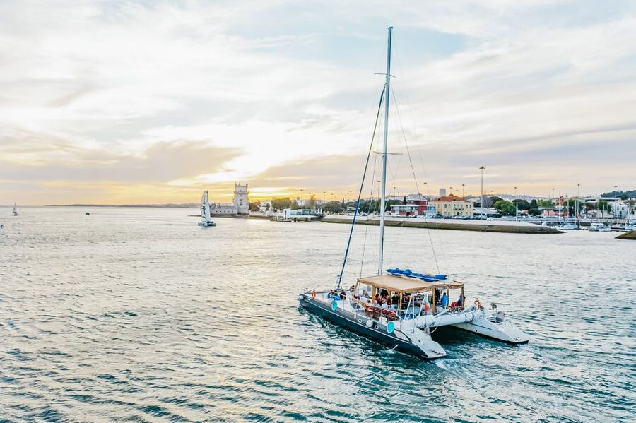 Lisbon: Sunset Catamaran Boat Tour with Music and Drinks - Music, Drinks, and the Social Mood