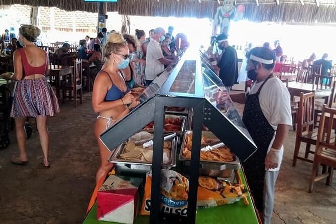 Live The Luxury Catamaran Isla Mujeres Tour in Cancun - Lunch, shade, and beach club time
