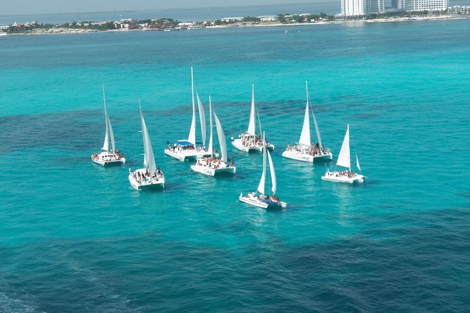 Live this unique experience. Catamaran to Isla Mujeres Tour. Open Bar included. - The return ride is the party portion