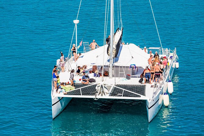 Live this unique experience. Catamaran to Isla Mujeres Tour. Open Bar included. - What the $75 total price really includes