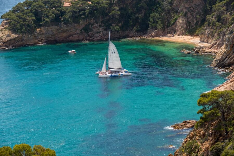 Lloret de Mar: Catamaran Sailing Cruise with BBQ and Drinks - From Lloret Beach to the open Costa Brava