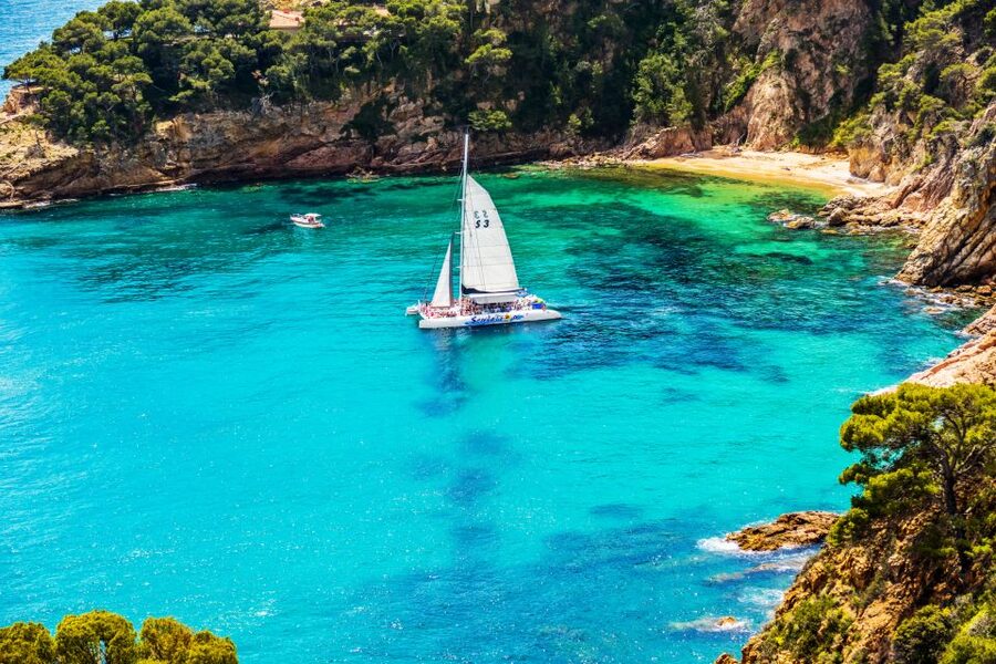 Lloret de Mar: Catamaran Sailing Cruise with BBQ and Drinks - Drinks, music, and the return journey