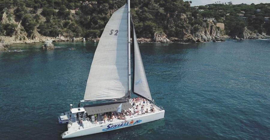 Lloret de Mar: Sunset Catamaran Cruise with DJ and Drinks - Setting out from Lloret de Mar at sunset
