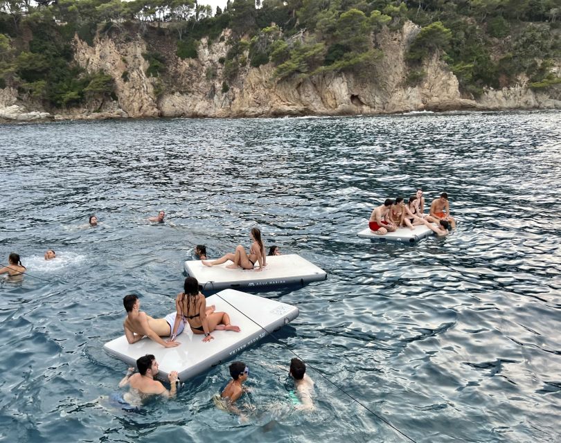 Lloret de Mar: Sunset Catamaran Cruise with DJ and Drinks - Swimming in the quiet inlet
