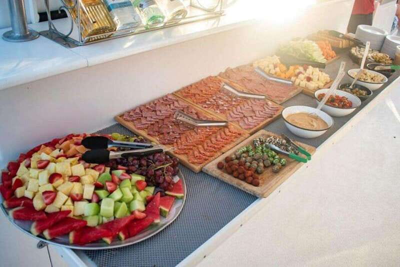 Los Cabos: Jazz & Wine Sunset Catamaran Cruise - Boarding the Tropicat for a two-hour cruise