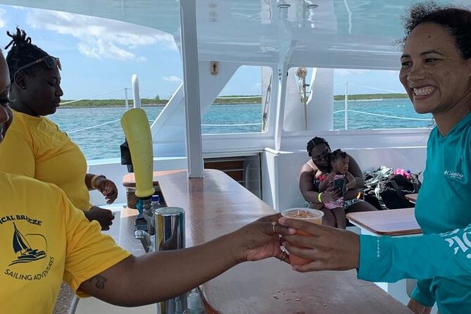 Luxury Catamaran Cruise: Sip, Sail, Snorkel, and Swim with Pigs! - Rum punch, conch salad, and the onboard mood