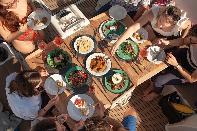 Luxury Catamaran Sunset Private & Greek Gastronomy in Athens - Vouliagmeni Beach and the Greek meal