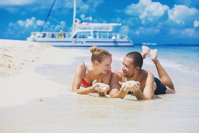 Luxury Cozumel Catamaran: Snorkel, Beach Club & Relaxation - Guided snorkeling in Cozumel’s clear water