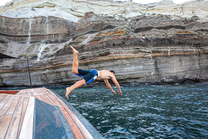 Luxury Private Power Catamaran Tour in Santorini - Armeni Bay closes the loop with swimming time