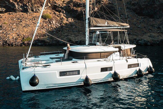 Majestic Catamaran Caldera Cruise with Snacks, Meal & Drinks - Passing Red Beach for the best photographs