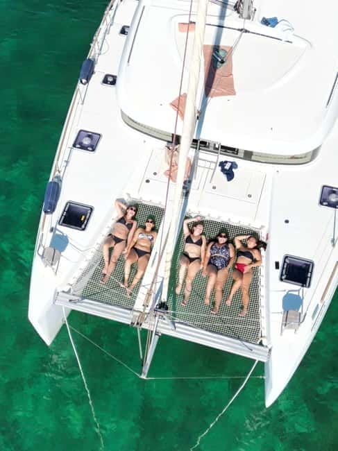 Majorca: Dinner aboard a private catamaran with snorkeling and paddle surfing - Swimming, snorkeling, and paddle surfing