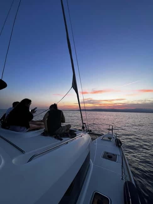 Majorca: Dinner aboard a private catamaran with snorkeling and paddle surfing - A short sail to the dinner cove