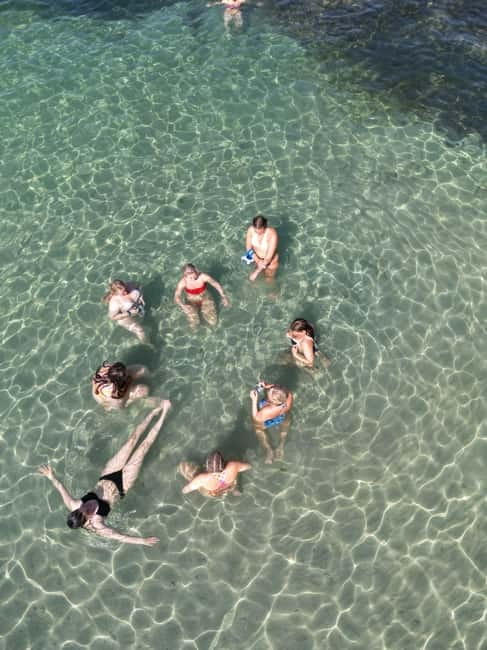 Majorca: Dinner aboard a private catamaran with snorkeling and paddle surfing - Booking, cancellation, and useful preparation