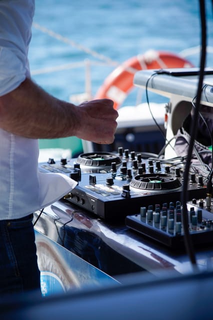 Malaga: Catamaran Sailing Cruise with Swimming & Optional DJ - Choosing between the regular cruise and DJ option