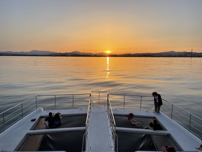 Málaga: Sunset Catamaran Trip - Leaving Málaga Port as the City Lights Up
