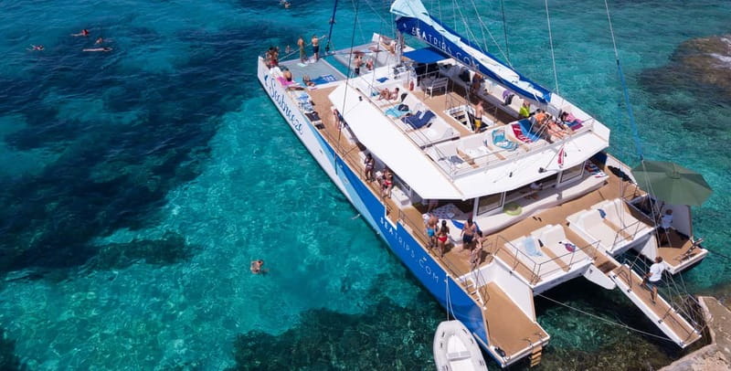 Malta: Blue Lagoon, Beaches & Bays Trip by Catamaran - Crystal Lagoon and the caves below the cliffs