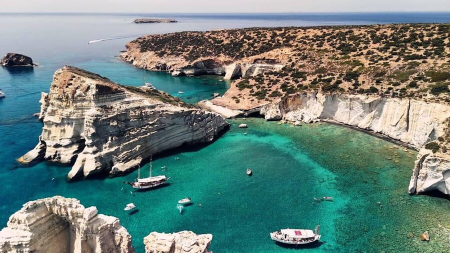 Milos: Full Day Luxury Catamaran with Full Meal & Open Bar - Leaving Adamantas with Coffee and Local Pastries
