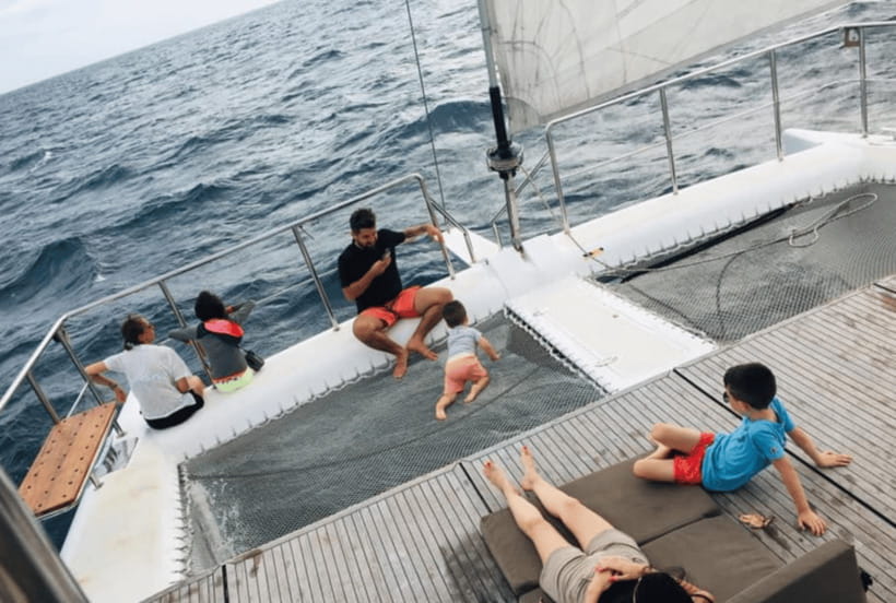 Mirissa: Sunset Catamaran Sailing Boat Tour with Dinner - What the crew adds to the evening