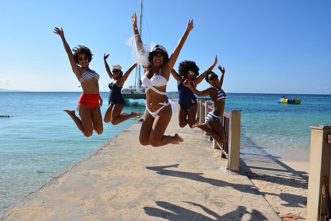 Montego Bay Private Afternoon Catamaran Open Bar and Snorkeling - Jamaican music, dance lessons, and the foot massage