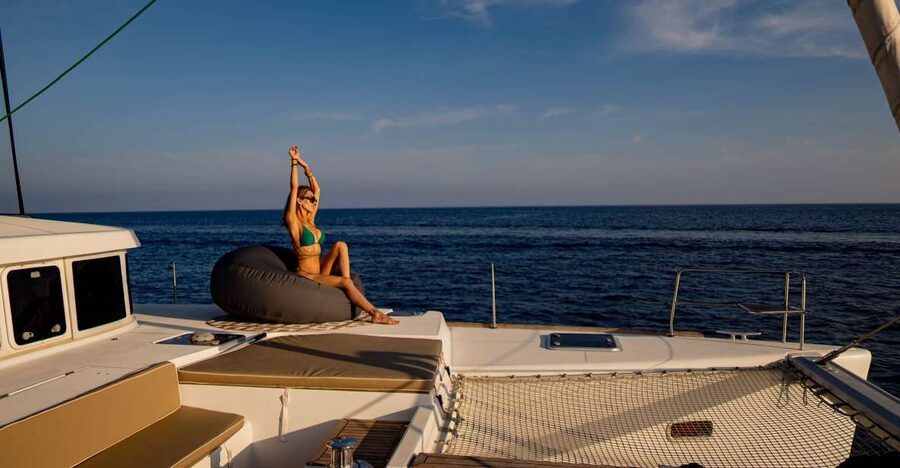 Mykonos: Boho Experience Catamaran Cruise - Sailing past Delos, the sacred island nearby