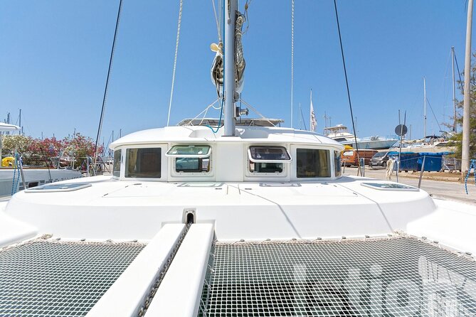 Mykonos Catamaran Cruise with Meal Drinks and Sup - Leaving Mykonos New Port by catamaran