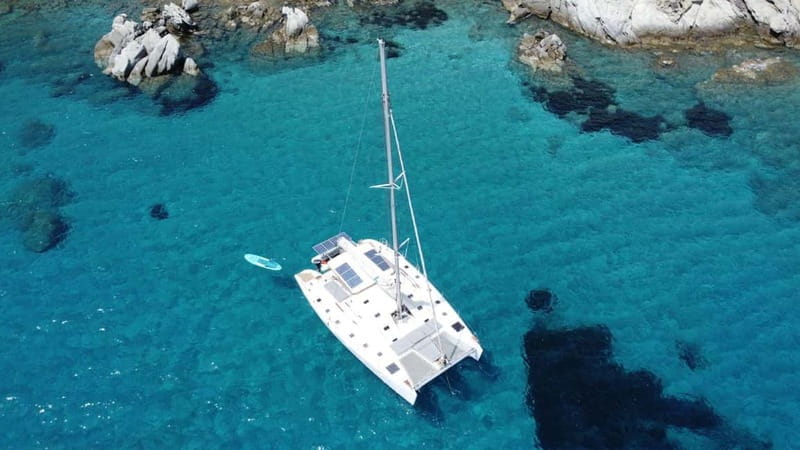 Mykonos: Catamaran Cruises with Lunch and Drinks - Lunch, fruit, and a drink in hand