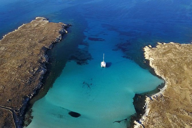 Mykonos Catamaran Full Day Private Cruise, 8-flavor Meal & Drinks - Delos or Mykonos’s south coast, depending on the wind