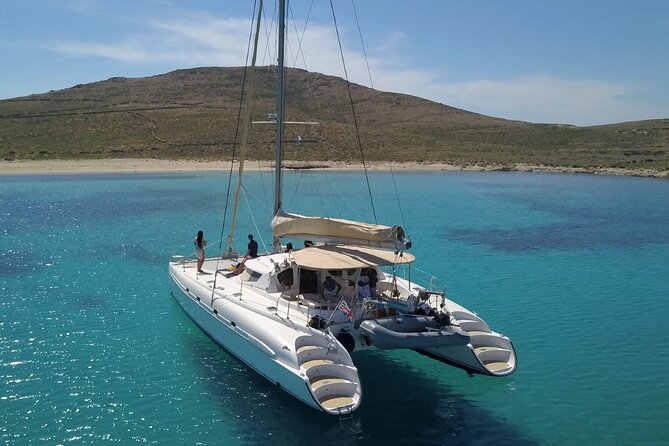 Mykonos Catamaran Premium Day-Sunset Tours 8-flavor Meal & Drinks - Rineia’s coves and swimming stops