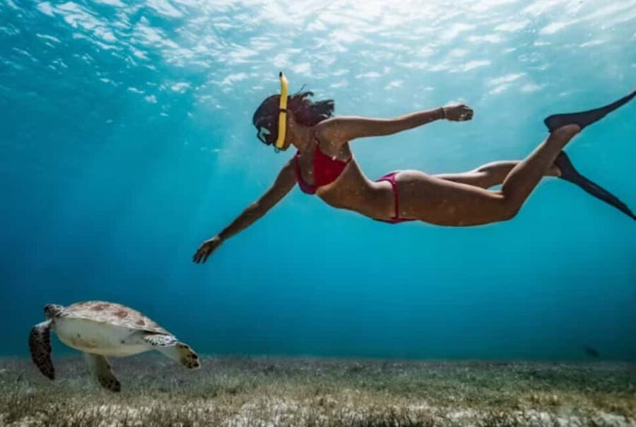 Nassau: Catamaran Sail and Snorkel Tour - Athol Island, Spruce Cay, and changing routes