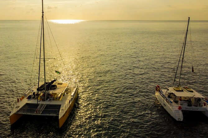 Negril Catamaran Morning Sail with Snorkeling & Pirate’s Cave - Drinks, Jamaican snacks, and the onboard party