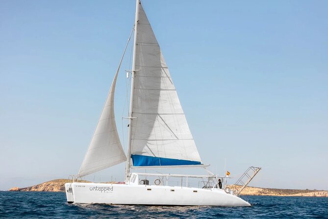 Ocean Catamaran Cruise Ibiza with Unlimited Drinks and BBQ - Sailing Ibiza’s southwest coast