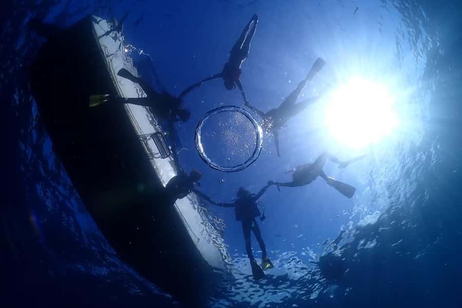 Onna: Blue Cave Snorkeling from Catamaran - Starting at the big shisa in Ryukyu Mura