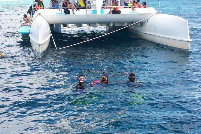 Party boat in Catamaran with Open Bar Only Adults + Snorkeling - Snorkeling over coral reefs