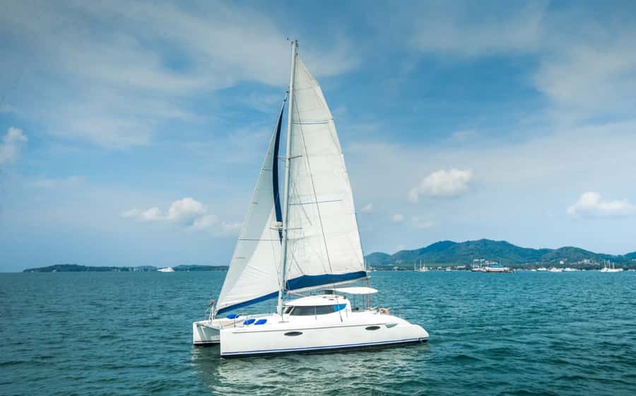 Phuket Catamaran Tour in Coral Island and Sunset Voyage - Boarding a two-level catamaran
