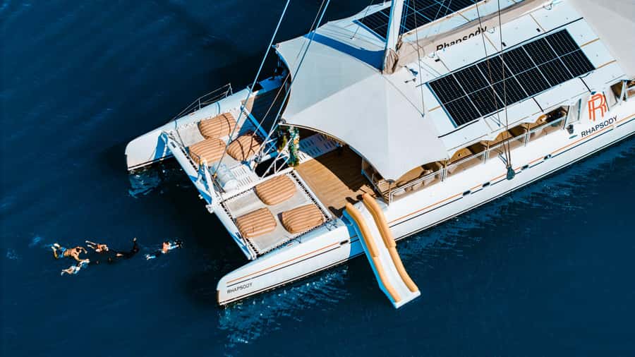 Phuket: Coral and Racha lslands Catamaran Tour with Lunch - The ride home: fishing, fruit, and Promthep Cape