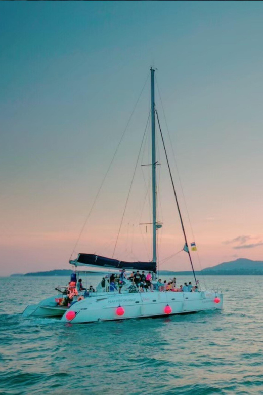 Phuket: Coral Island Catamaran Cruise with Sunset Dinner - Dinner with the sunset near Promthep Cape