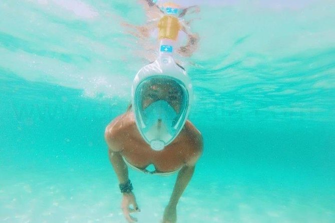 Playa Sa Roqueta Private Catamaran Trip - Snorkeling, paddleboarding, and the dinghy