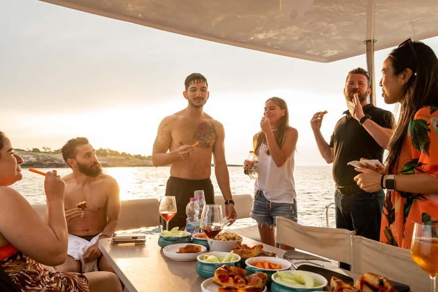 Polignano a Mare: Catamaran Tour with Aperitif & Local Food - Grotta Palazzese and the coastal caves