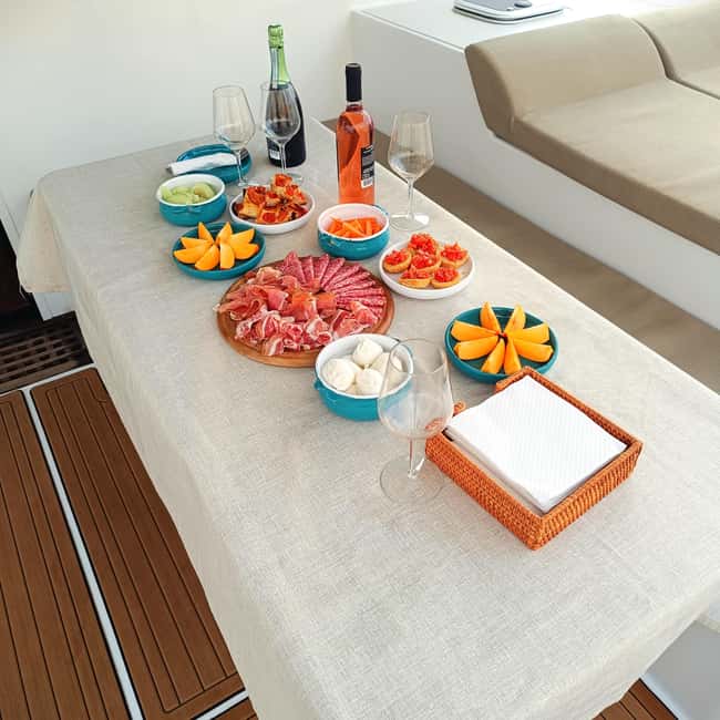 Polignano a Mare: Catamaran Tour with Aperitif & Local Food - Lama Monachile and the Bourbon bridge from below