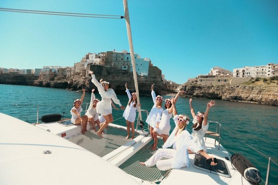 Polignano: Catamaran Cruise with Aperitif and Food - Grotta Palazzese from the water
