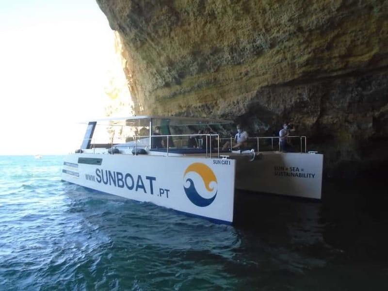 Portimão: Benagil Caves & Golden Coast Eco Catamaran Tour - Entering Benagil Cave from the sea