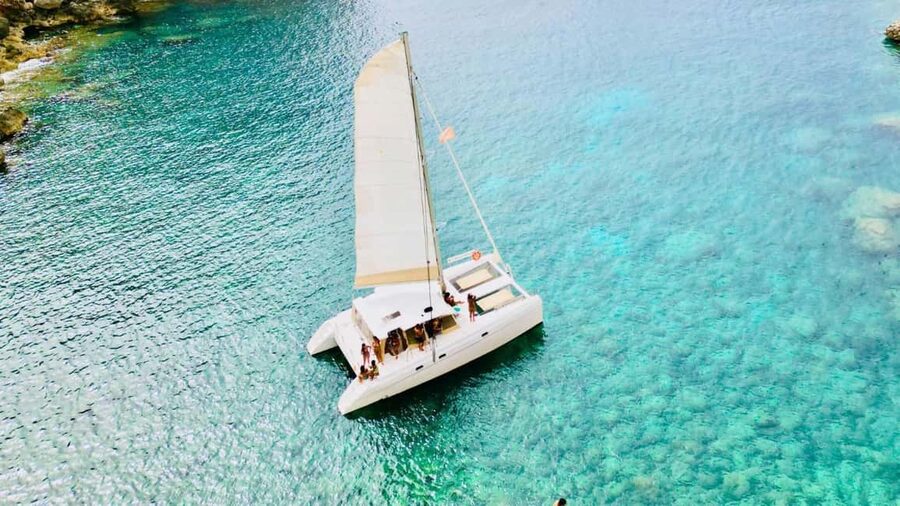 Porto Conte: Sunset catamaran excursion with aperitif - Cala Bramassa: the main swim stop