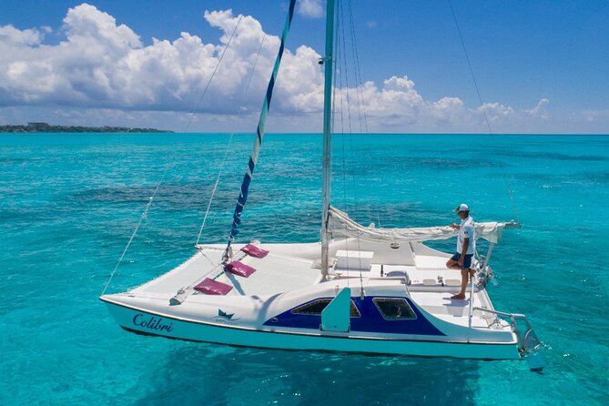 Premium Isla Mujeres Tour by Private Catamaran - Meeting the crew at Playa Tortugas