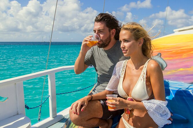 Private Catamaran Adventure Cruise with Rope Swing and Water Slide - Setting out from Noord on the Dolphin
