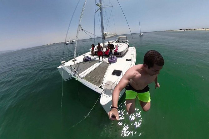 Private Catamaran Boat Tour - Ria Formosa - Paddleboarding and the balance between luxury and activity