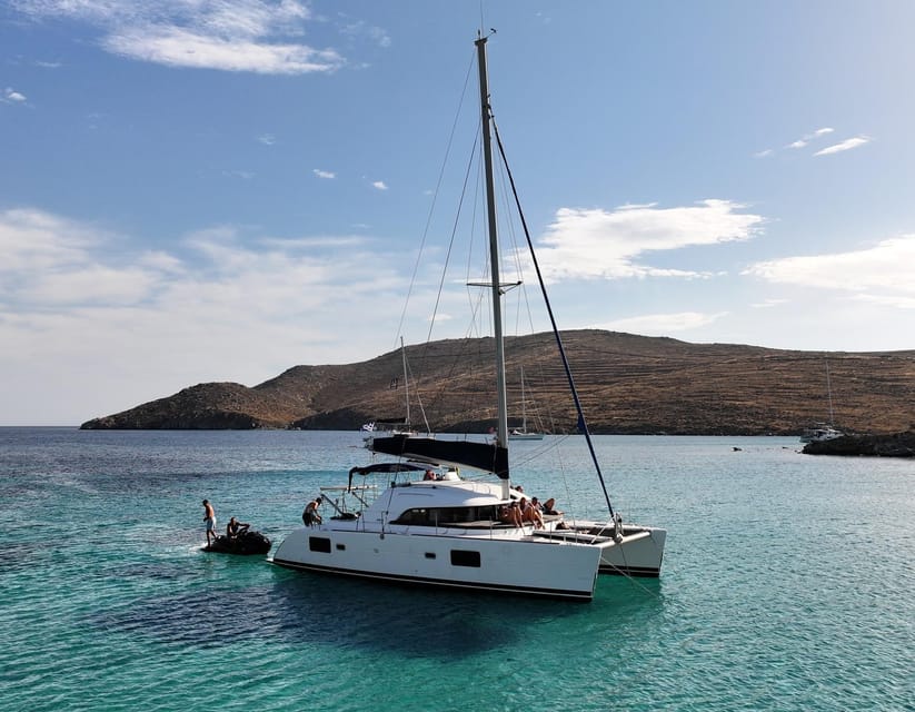 Private Catamaran Cruise Mykonos Delos with Meals & SUP - Leaving Mykonos with the white houses behind you