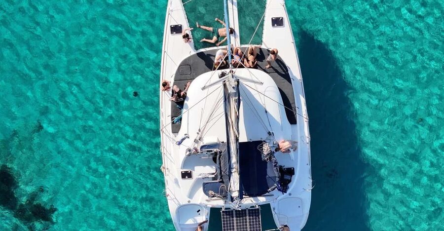 Private Catamaran Cruise Mykonos Delos with Meals & SUP - Rhenia’s quiet cove and clear water